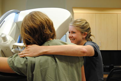 Picture of two female nurses standing next to each other in a Mammogram room