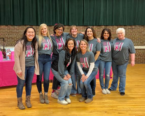 Cabinet Peaks Medical Center held its annual fundraising, including Ladies Night Out, Breast Health Awareness Dessert and BINGO to support the Paint It Pink program. There is nine females in the picture, smiling